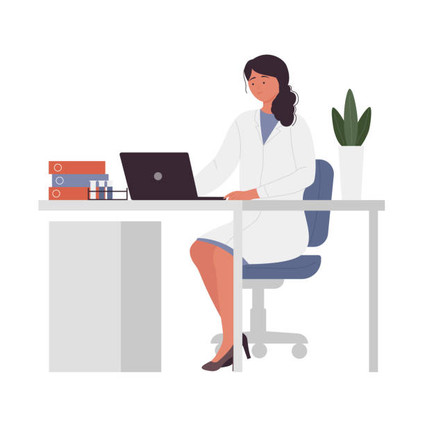 Doctor sitting at a desk with clinic software on screen
